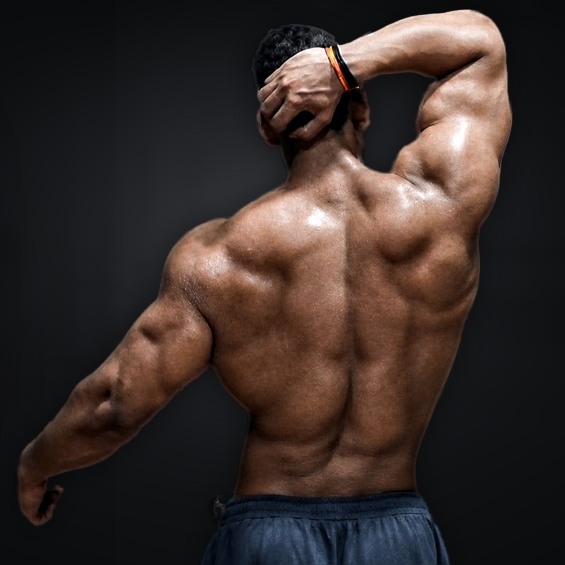 Siddharth Dev, fitness creator, back pose with one hand on his head